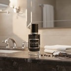 Ganelli No.11 for Him perfume bottle on bathroom counter; dark glass, black cap, Ganelli label.