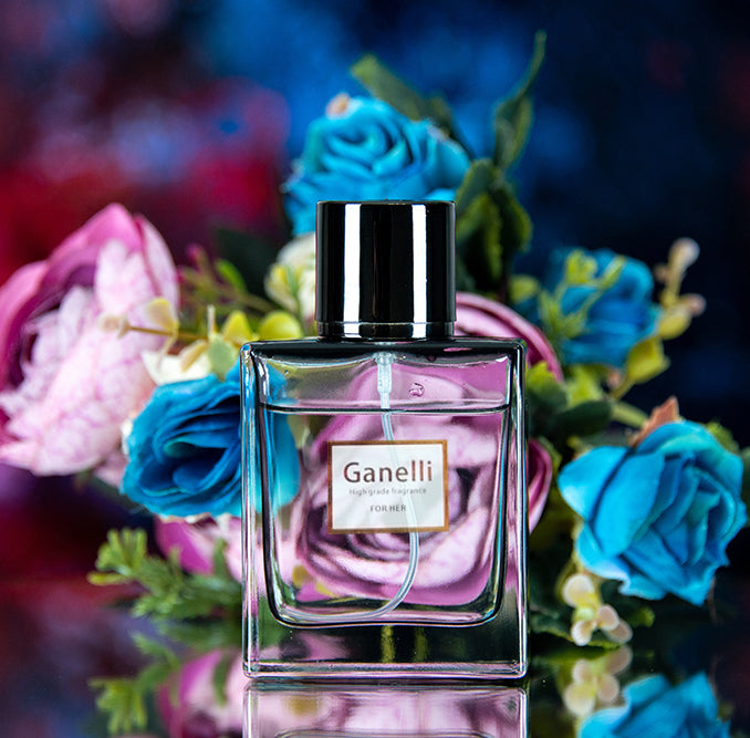 Ganelli No. 7 for Her perfume bottle, eau de parfum, pink liquid with silver cap, set against colorful flowers.